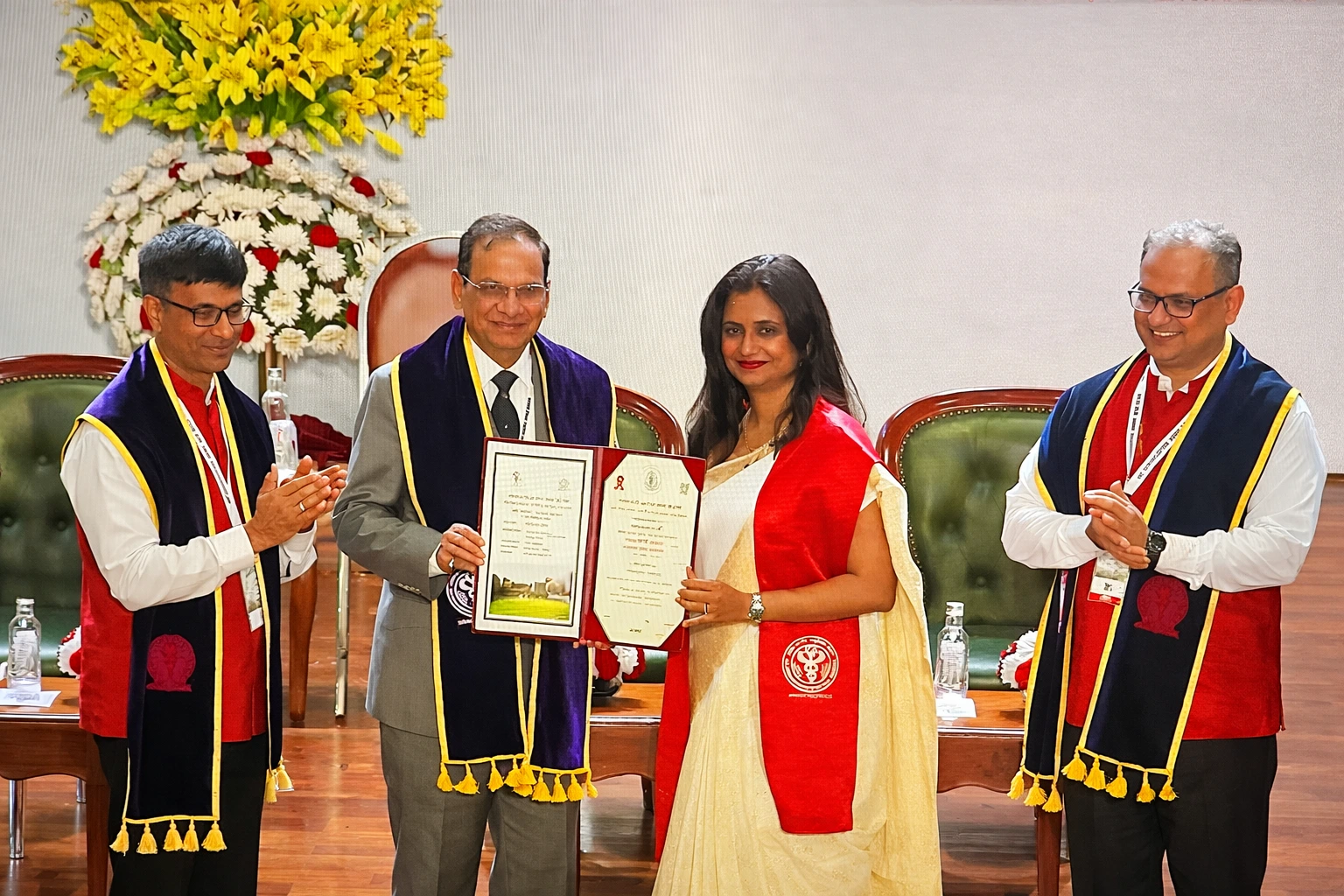 Dr. Dipanwita Banerjee, Gynaecological Oncologist, receiving recognition in Kolkata